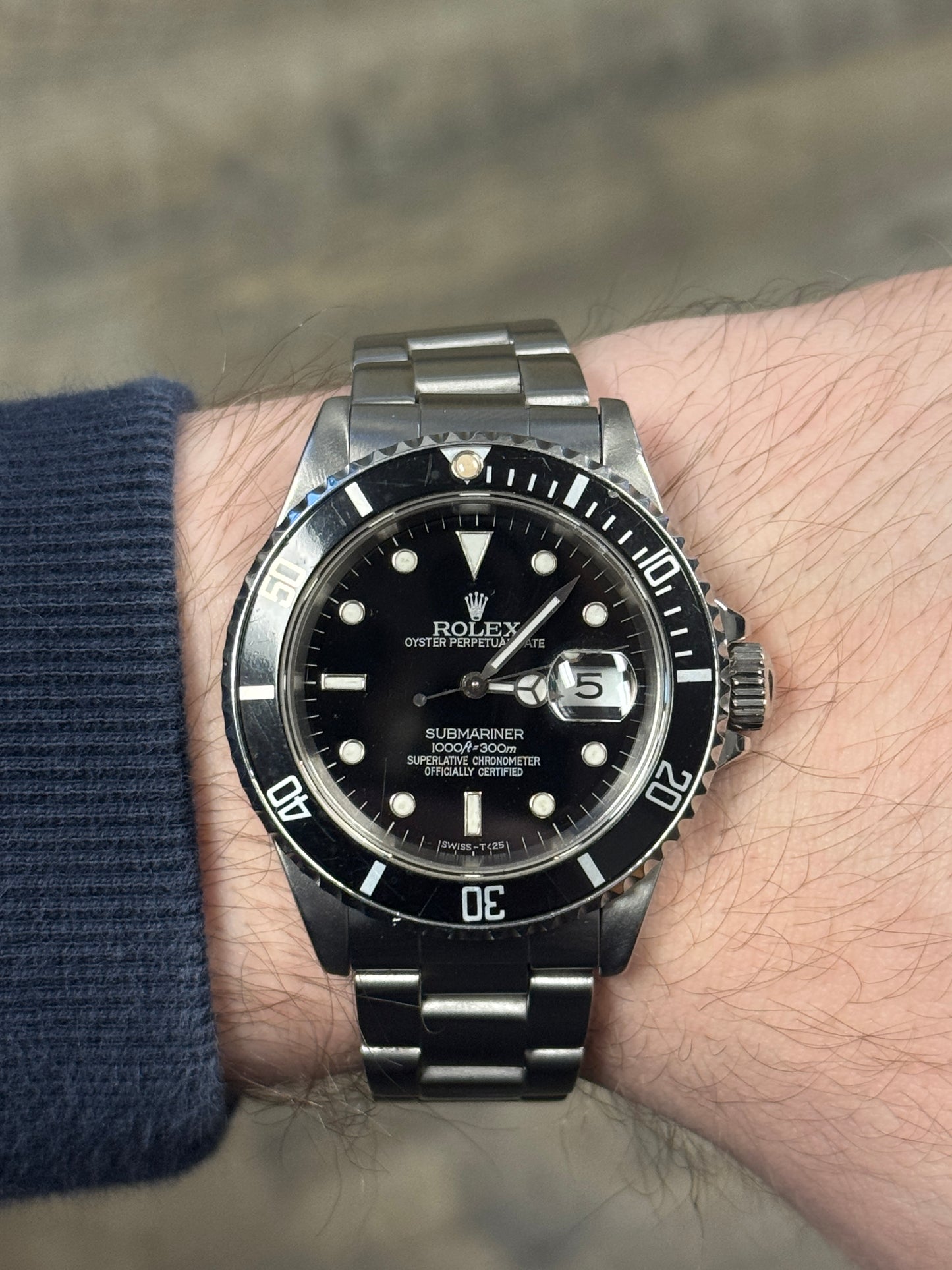 1989 Rolex Submariner Date 16610LN black dial on wrist