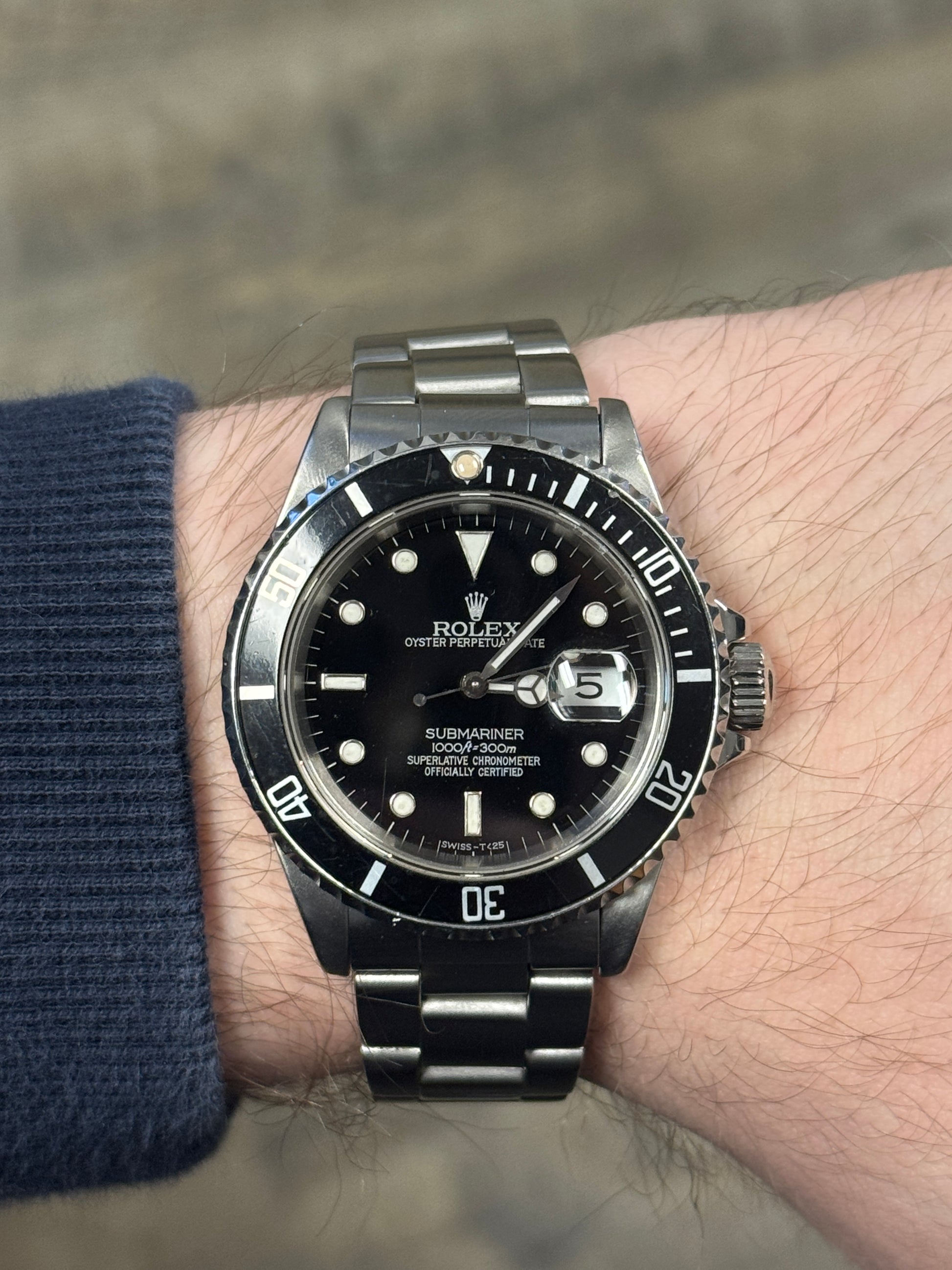 1989 Rolex Submariner Date 16610LN black dial on wrist
