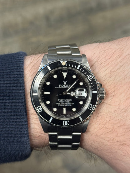 1989 Rolex Submariner Date 16610LN black dial on wrist